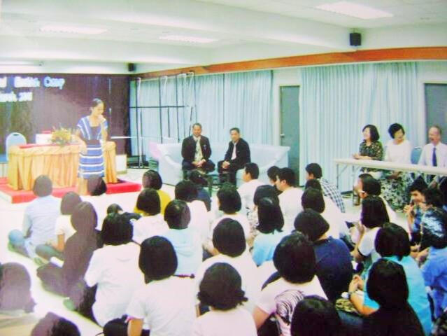 Emceeing a school event for Thai students, leaders, and colleagues — including our British English teacher
